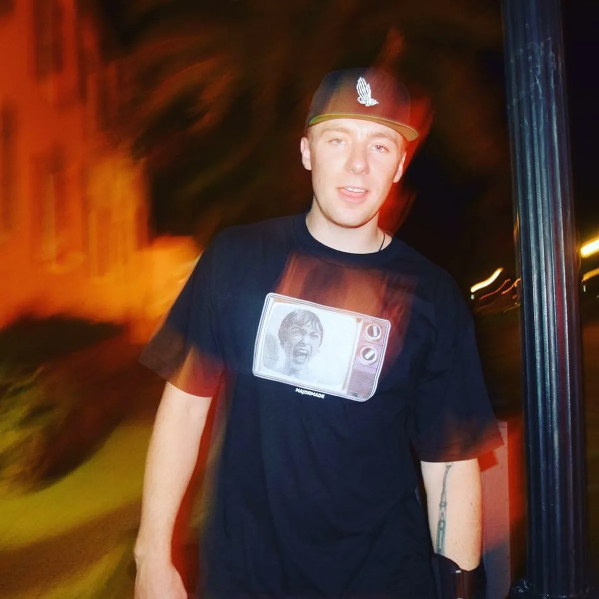 Night portrait with TV graphic tee