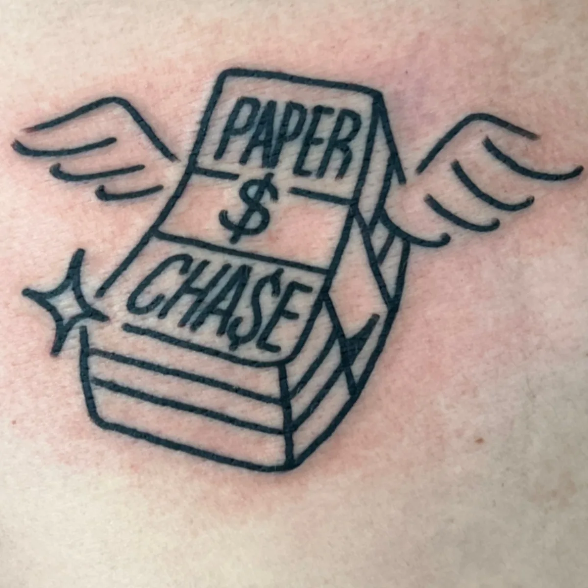 PAPER CHASE winged cash tattoo