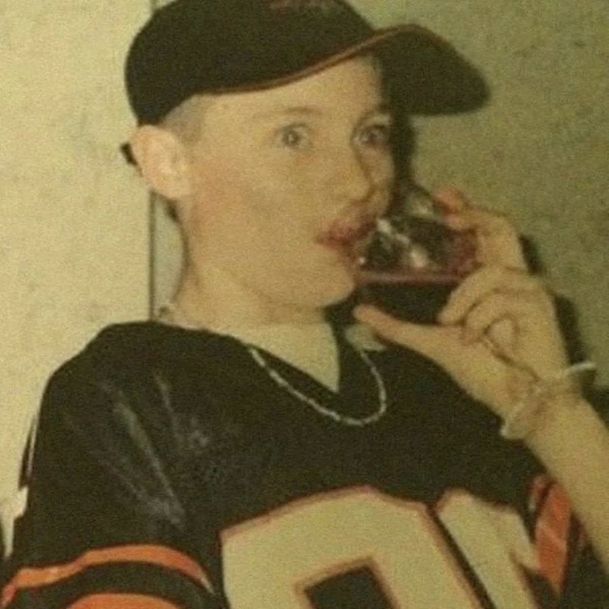 Young Chase in vintage jersey with wine