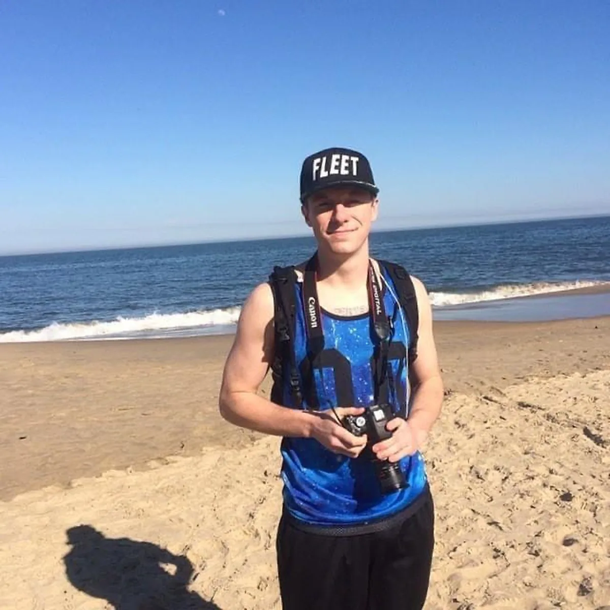 FLEET cap on the beach with camera